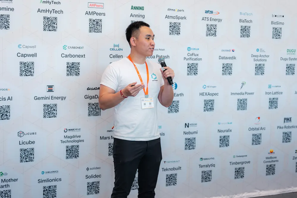 The Open House step-and-repeat, covered in exhibitor logos