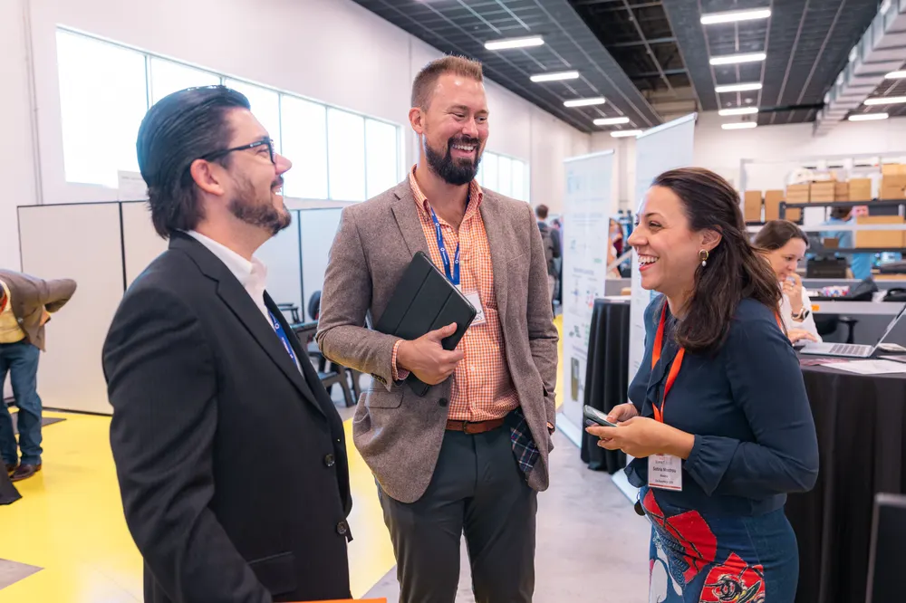 Attendees network on the Open House floor
